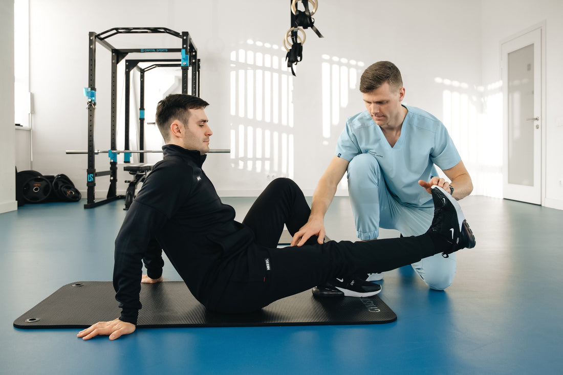 Stock photo of a physiotherapist helping a patient with rehabilitation exercises
